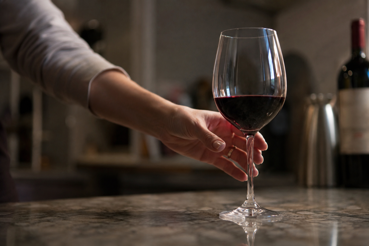 Hand automatically reaching for a wine glass