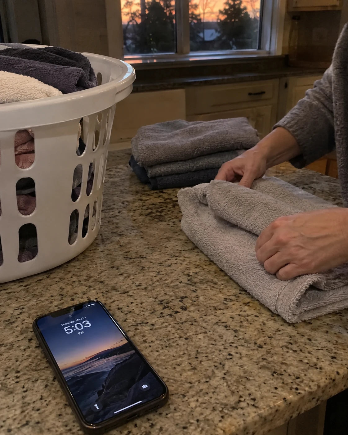 Phone showing 5:03pm on the kitchen counter, no wine glass in sight